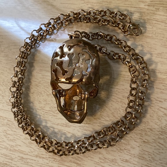 Somebody needs this gold color crystal brained scull necklace with sparkly eyes. - Picture 2 of 6